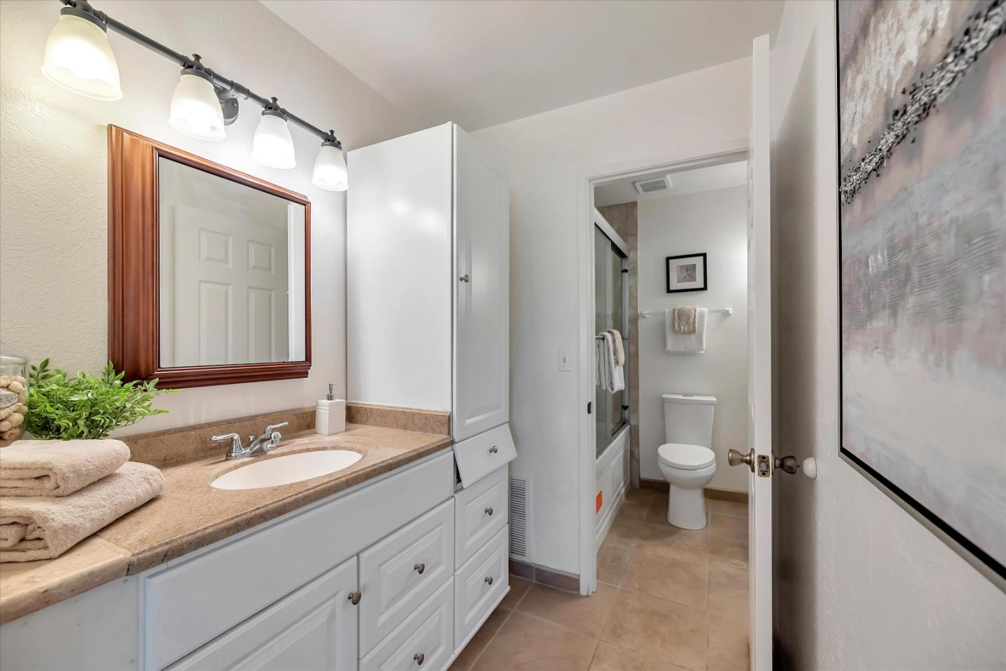 17075 Creekside Circle Morgan Hill, CA 95037 - Photo 23 of 49 a bathroom with a granite countertop sink toilet and shower