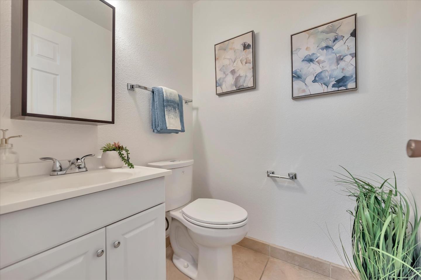 17075 Creekside Circle Morgan Hill, CA 95037 - Photo 25 of 49 a bathroom with a toilet a sink and mirror