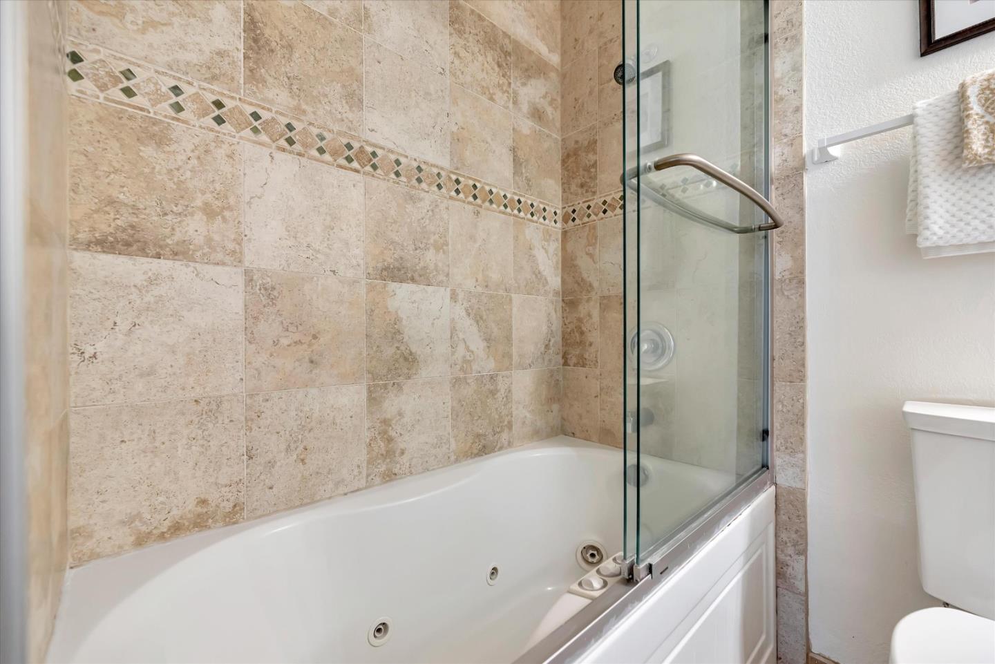 17075 Creekside Circle Morgan Hill, CA 95037 - Photo 29 of 49 a bathroom with a tub and a shower