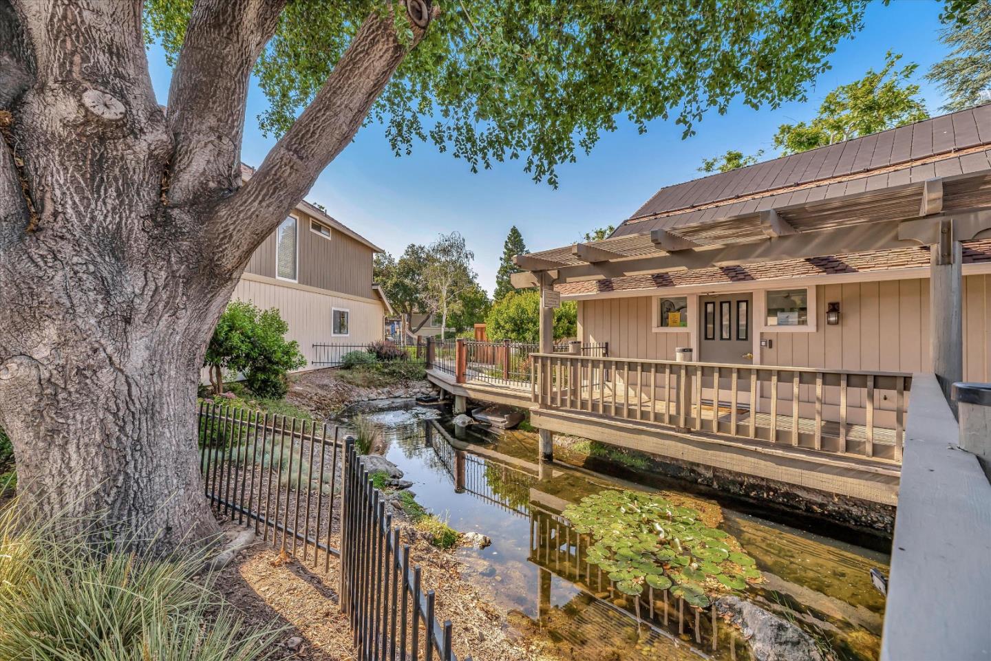 17075 Creekside Circle Morgan Hill, CA 95037 - Photo 36 of 49 a view of a house with wooden deck and a small yard