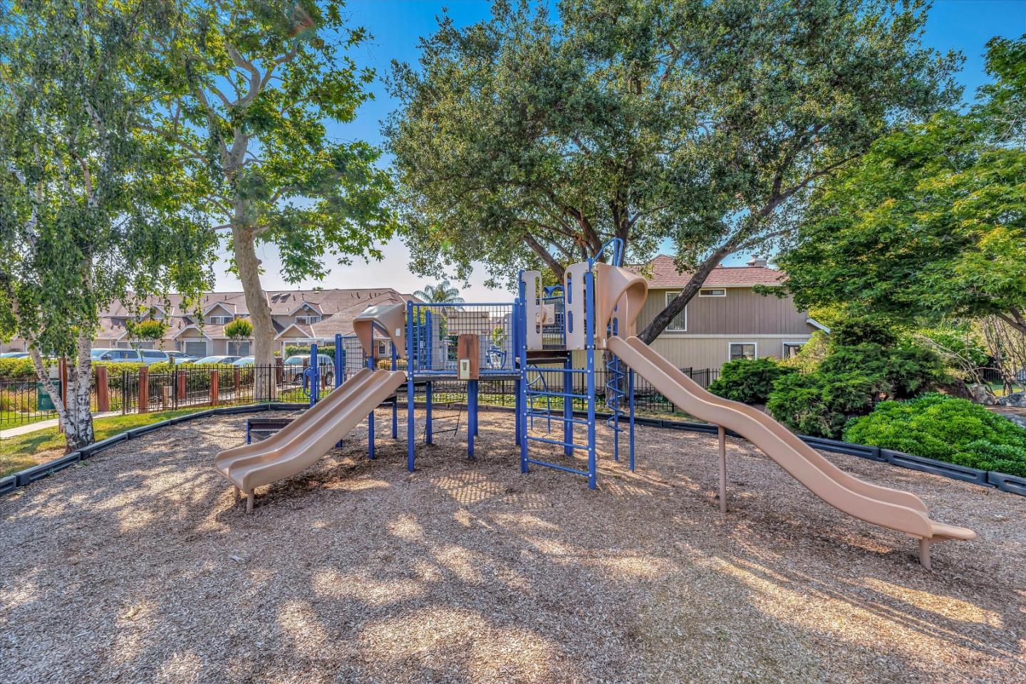 17075 Creekside Circle Morgan Hill, CA 95037 - Photo 39 of 49 a view of a roof deck with wooden fence and a couple of chairs