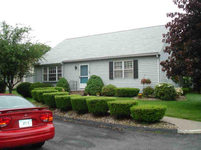 4 Maybury Road, Unit 4 Suffield, CT 06078 - Photo 1 of 1 a front view of a house with a yard