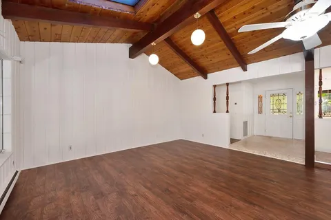 a view of a living room with a flat screen tv