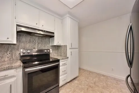 a view of a storage & utility room with a washer dryer