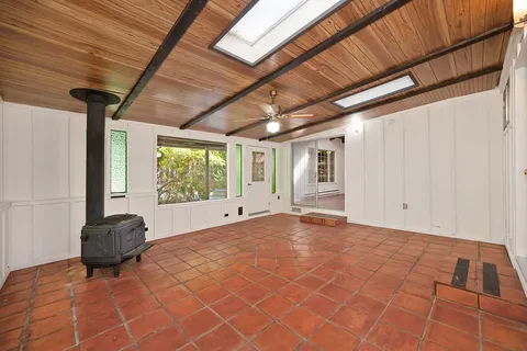 a bathroom with a sink a mirror and a light fixture