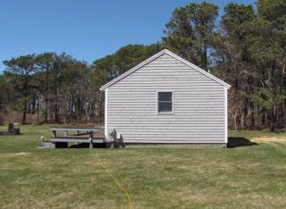 121 Shore Road, Unit 1 Truro, MA 02666 - Photo 3 of 8 a view of a house with a yard