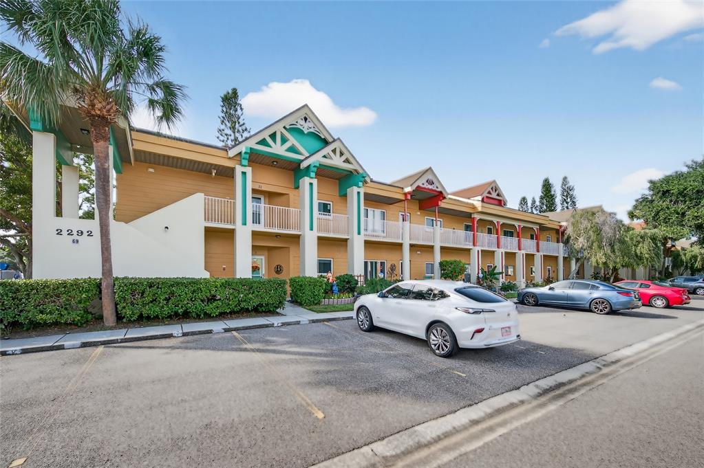 2292 Austrian Lane, Unit 26 Clearwater, FL 33763 - Photo 1 of 27 a car parked in front of a white house