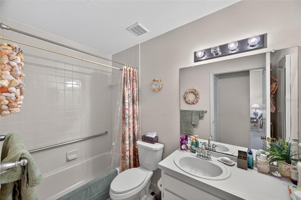 2292 Austrian Lane, Unit 26 Clearwater, FL 33763 - Photo 18 of 27 a bathroom with a sink toilet and shower