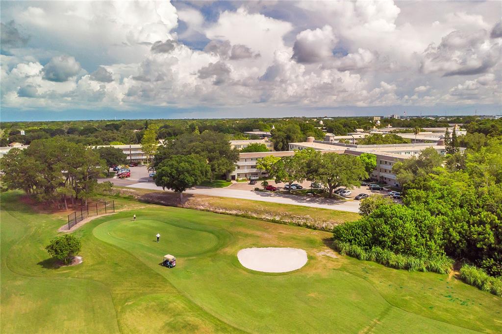 2292 Austrian Lane, Unit 26 Clearwater, FL 33763 - Photo 25 of 27 a view of a swimming pool with an ocean view