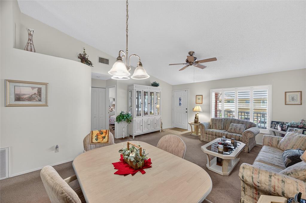 2292 Austrian Lane, Unit 26 Clearwater, FL 33763 - Photo 5 of 27 a living room with furniture and a large window