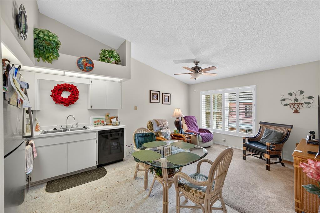 2292 Austrian Lane, Unit 26 Clearwater, FL 33763 - Photo 9 of 27 a living room with furniture and a window