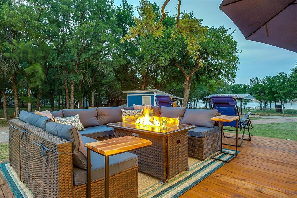 520 Deer Trail Gordon, TX 76453 - Photo 35 of 40 Wooden deck with an outdoor living space with a fire pit