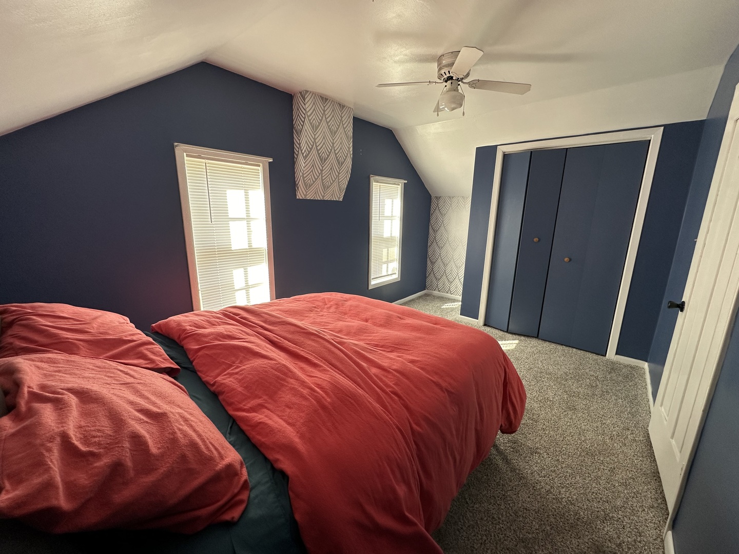 624 West Lincolnway Road Morrison, IL 61270 - Photo 22 of 26 a bedroom with a bed and a chandelier