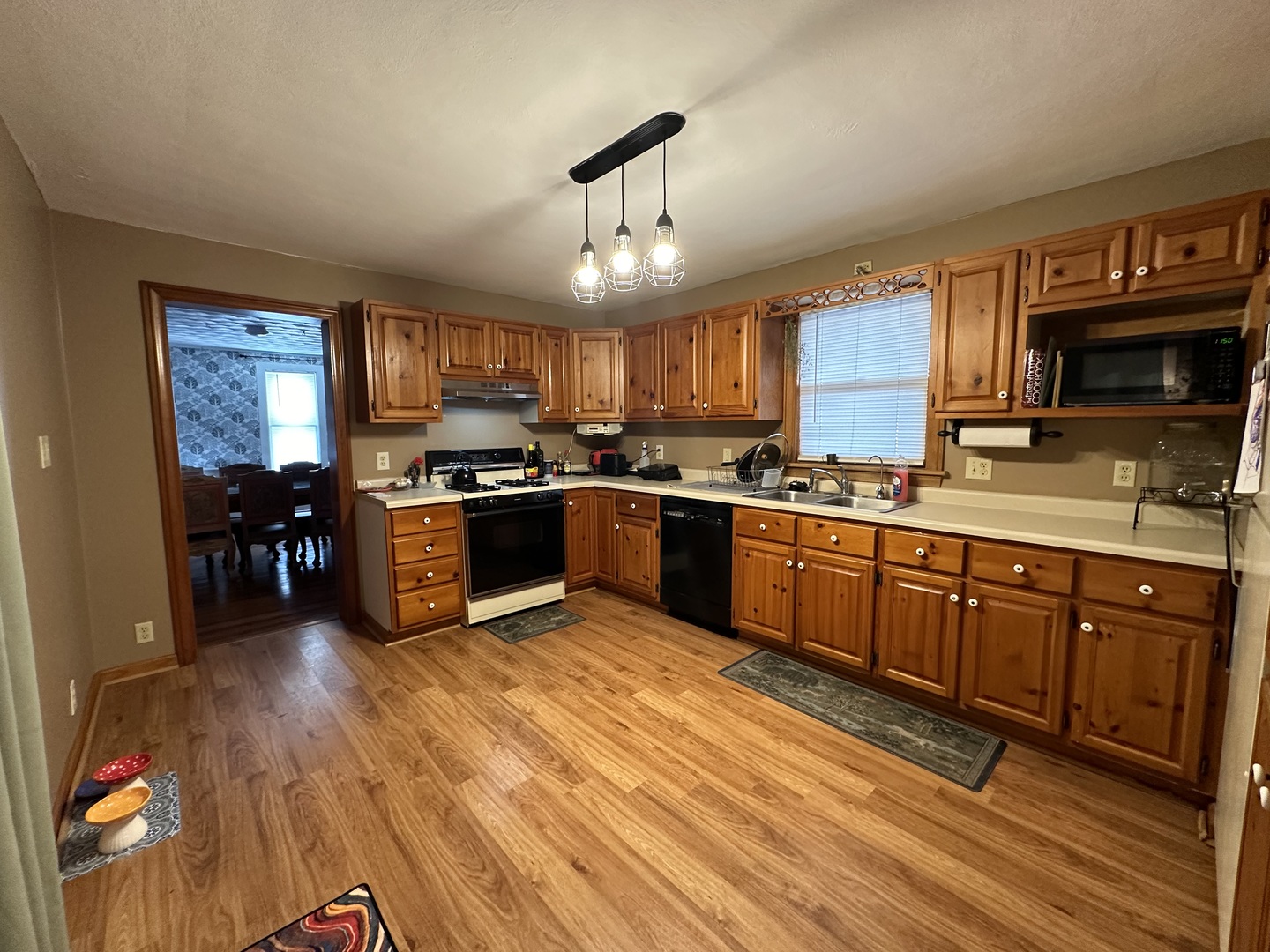 624 West Lincolnway Road Morrison, IL 61270 - Photo 8 of 26 a large kitchen with stainless steel appliances granite countertop a stove sink and cabinets