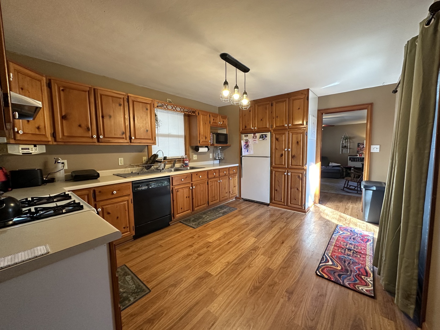 624 West Lincolnway Road Morrison, IL 61270 - Photo 9 of 26 a kitchen with refrigerator and cabinets