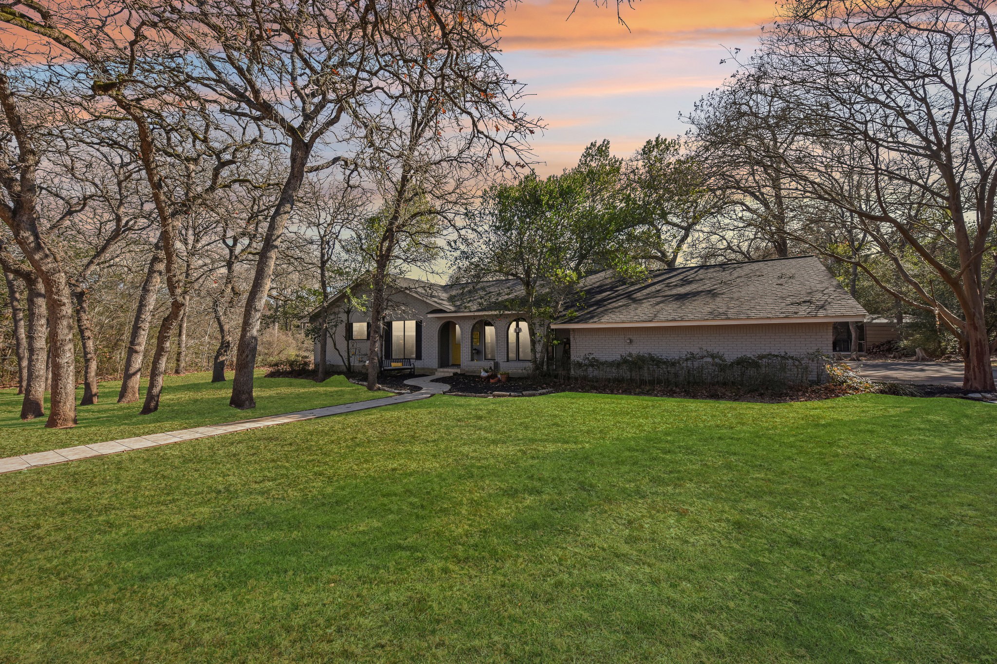 111 Post Oak Lane Elgin, TX 78621 - Photo 2 of 39 Front virtual twilight and green grass photo