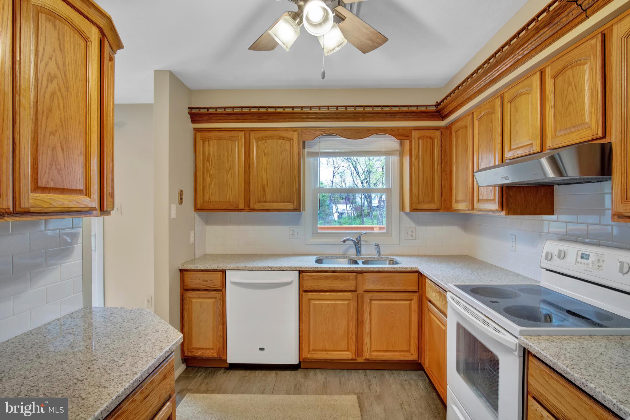 45 Sam Snead Circle Etters, PA 17319 - Photo 12 of 34 a kitchen with a sink stove and cabinets