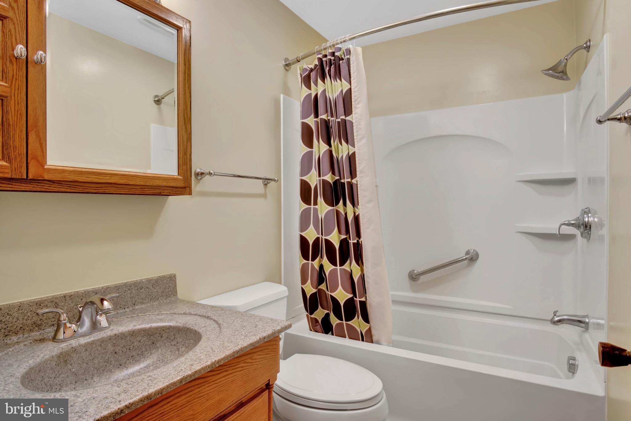 45 Sam Snead Circle Etters, PA 17319 - Photo 13 of 34 a bathroom with a granite countertop sink toilet and shower