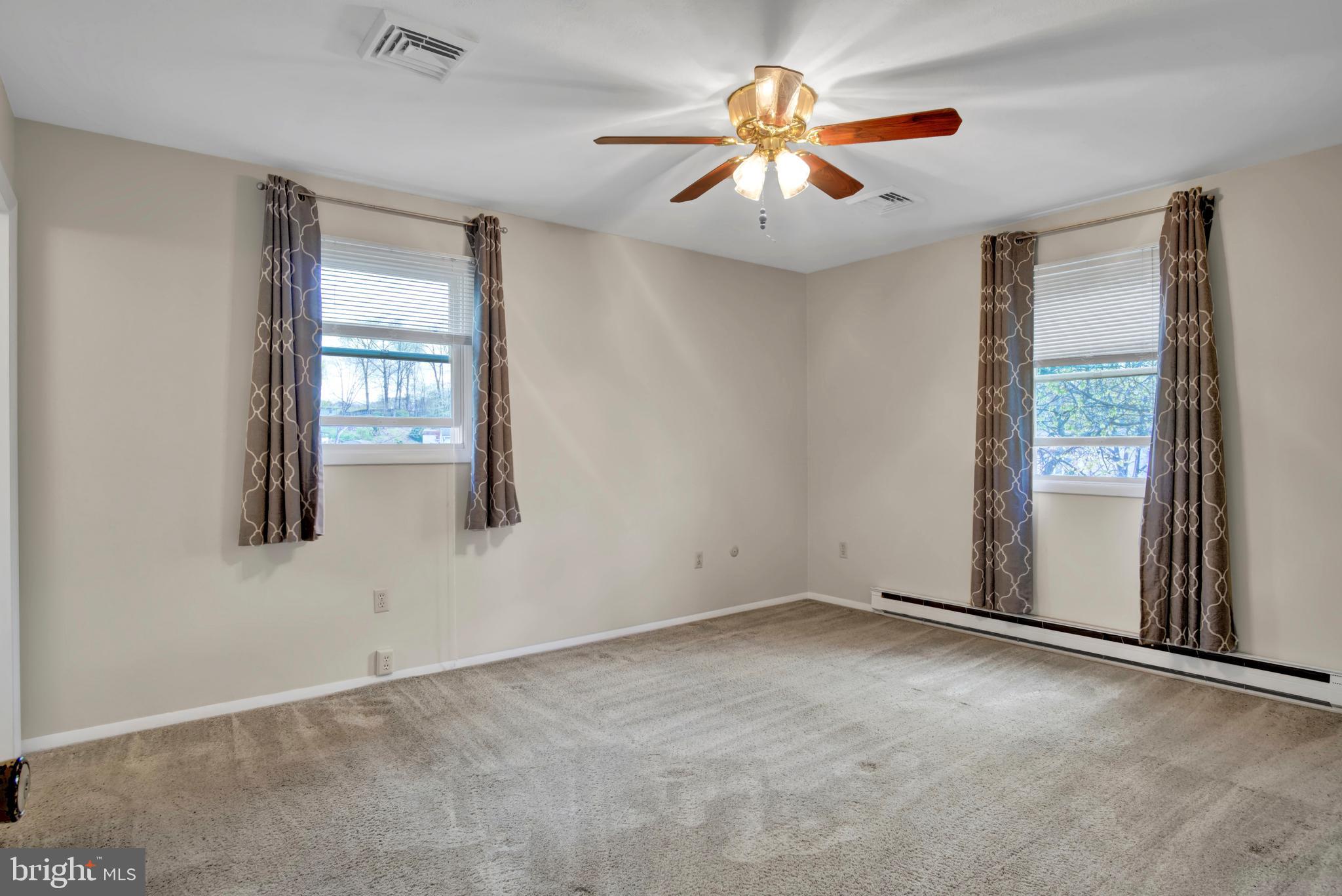 45 Sam Snead Circle Etters, PA 17319 - Photo 14 of 34 an empty room with windows and fan