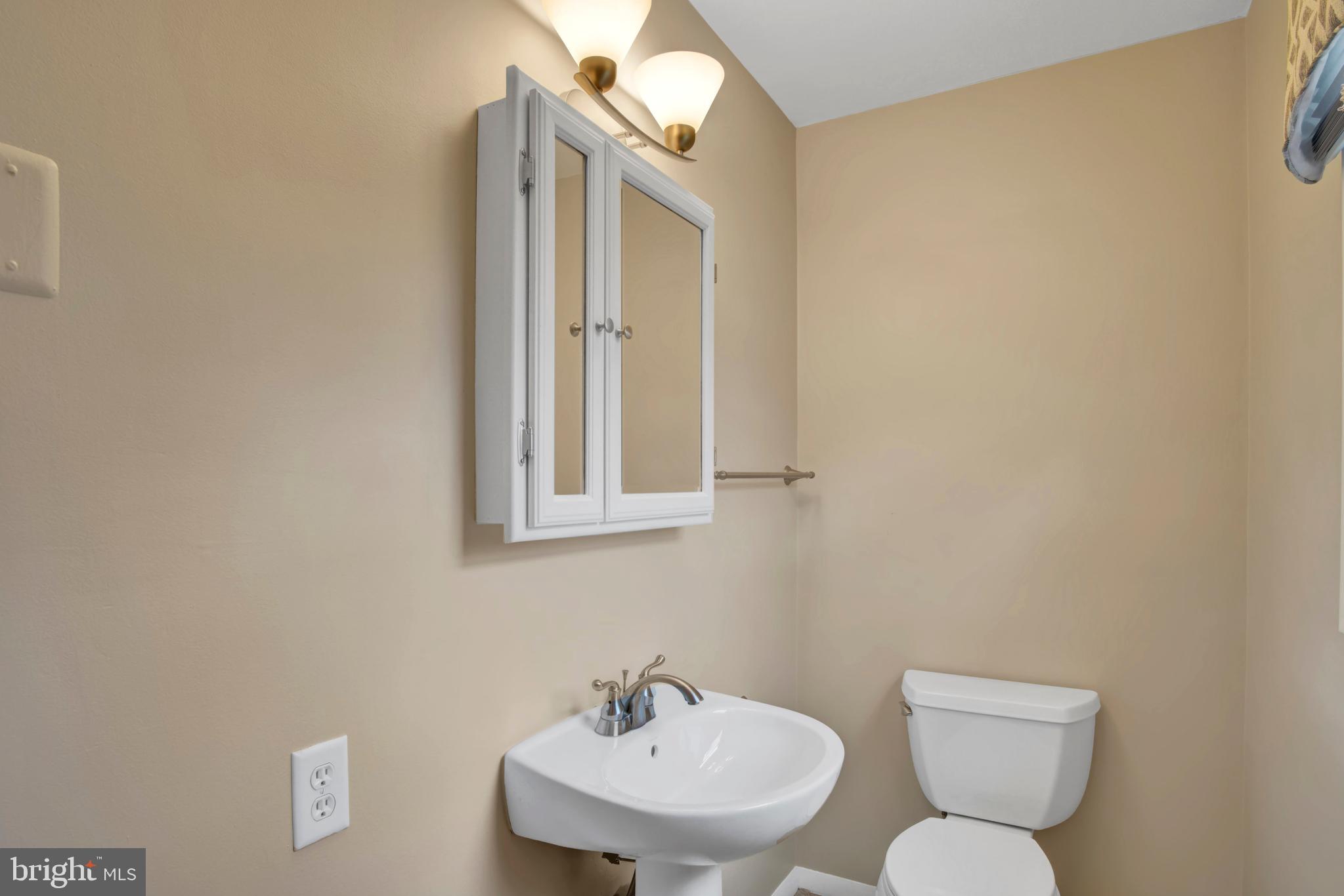 45 Sam Snead Circle Etters, PA 17319 - Photo 16 of 34 a bathroom with a toilet a sink and mirror