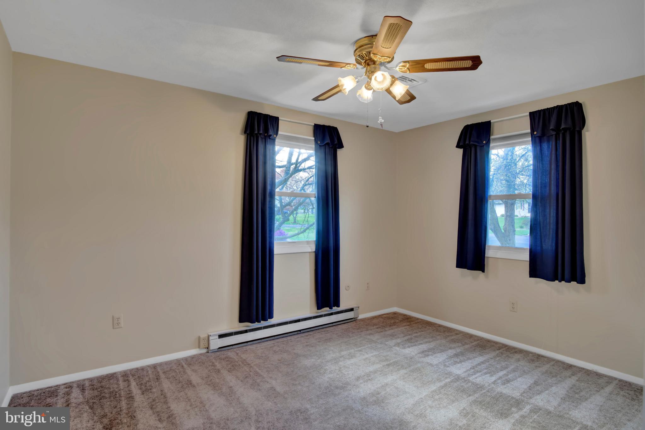 45 Sam Snead Circle Etters, PA 17319 - Photo 17 of 34 an empty room with windows and fan