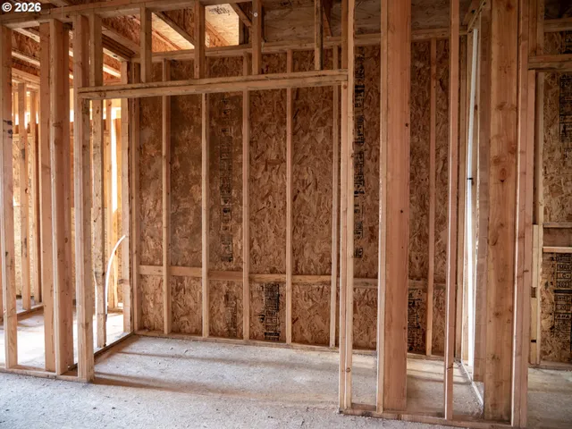 a view of an empty room with wooden walls