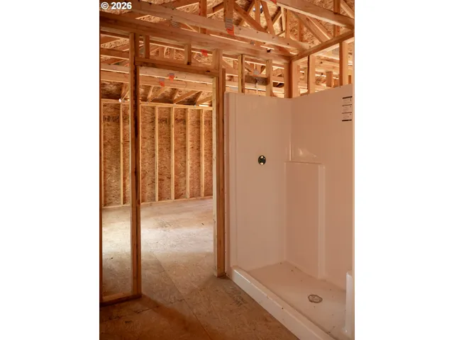 a view of a room with wooden walls