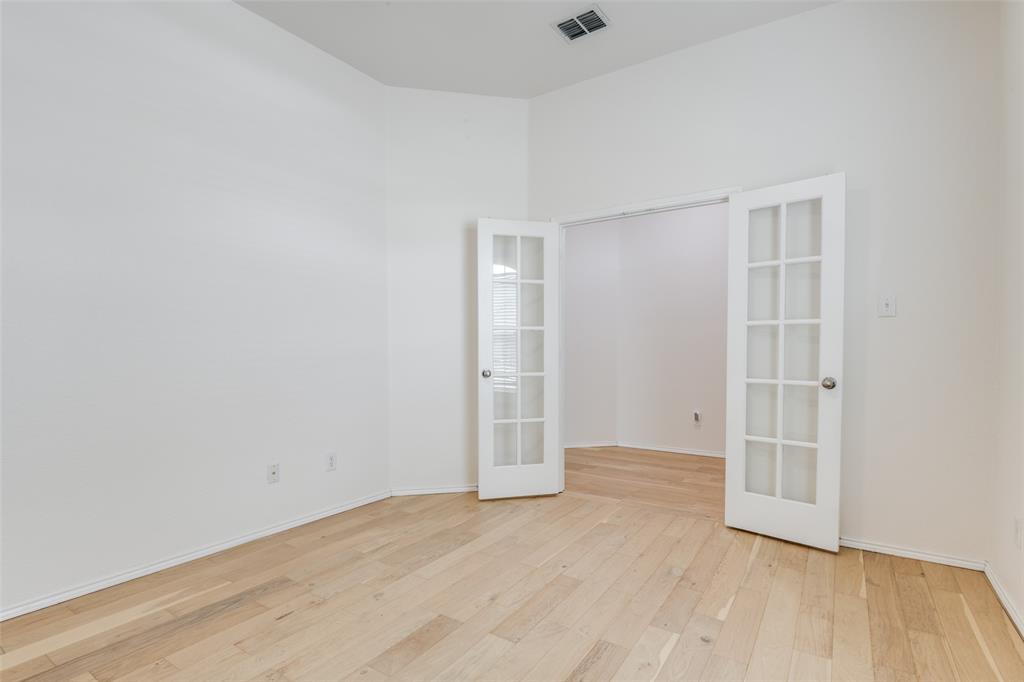 405 Hackberry Drive Fate, TX 75087 - Photo 12 of 24 an empty room with a natural light