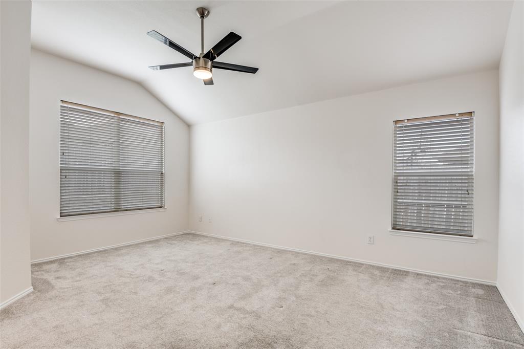 405 Hackberry Drive Fate, TX 75087 - Photo 18 of 24 an empty room with fan and windows