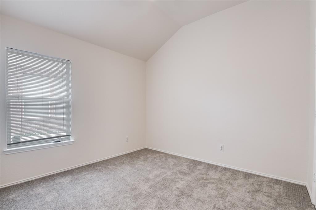 405 Hackberry Drive Fate, TX 75087 - Photo 22 of 24 an empty room with a window