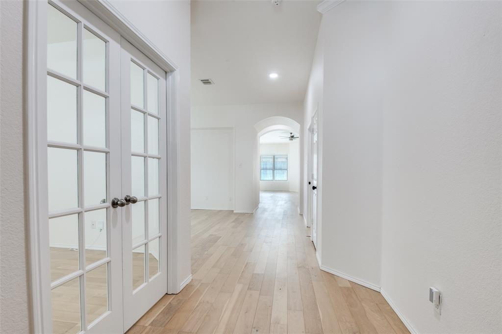 405 Hackberry Drive Fate, TX 75087 - Photo 3 of 24 wooden floor in an empty room