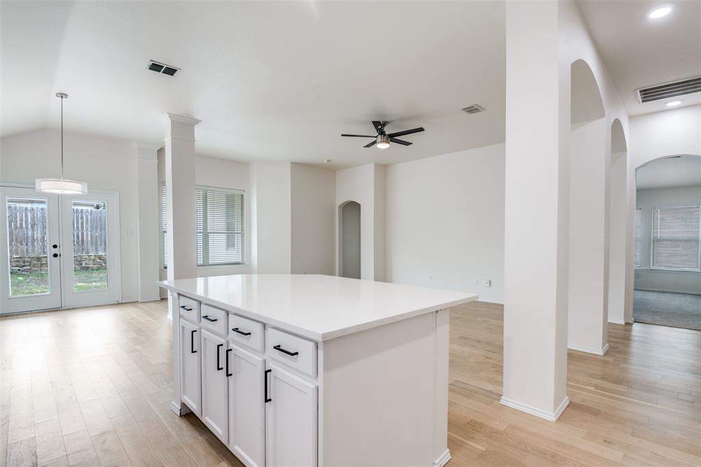 405 Hackberry Drive Fate, TX 75087 - Photo 8 of 24 a view of a kitchen cabinets and wooden floor