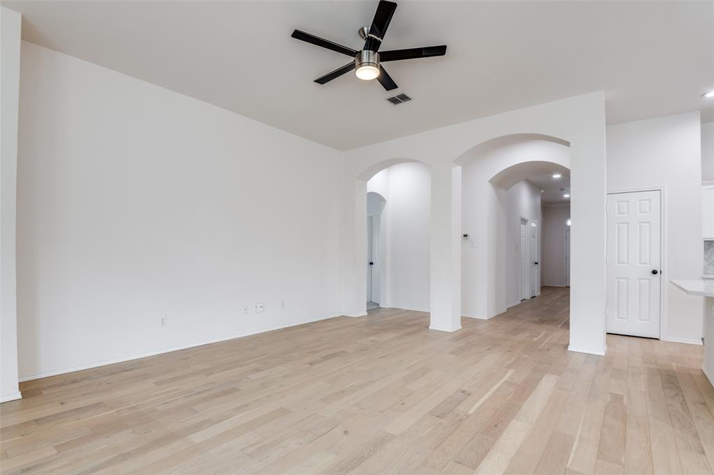 405 Hackberry Drive Fate, TX 75087 - Photo 10 of 24 wooden floor in an empty room