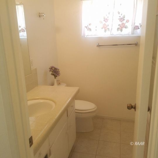 324 West Perdew Avenue Ridgecrest, CA 93555 - Photo 13 of 14 a bathroom with a sink and toilet