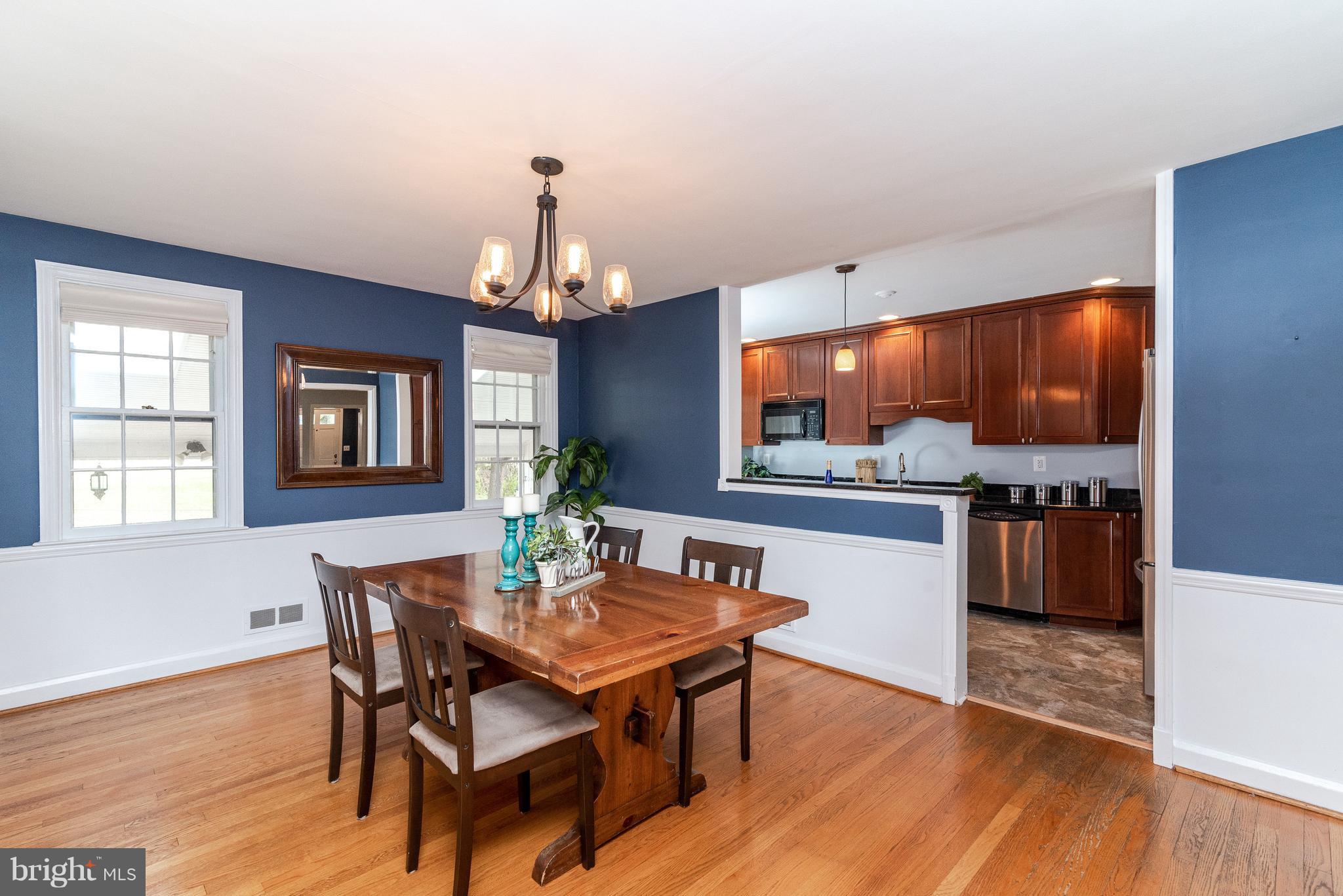 411 Lambeth Road Baltimore, MD 21228 - Photo 5 of 26 Large Dining Room opens to remodeled Kitchen