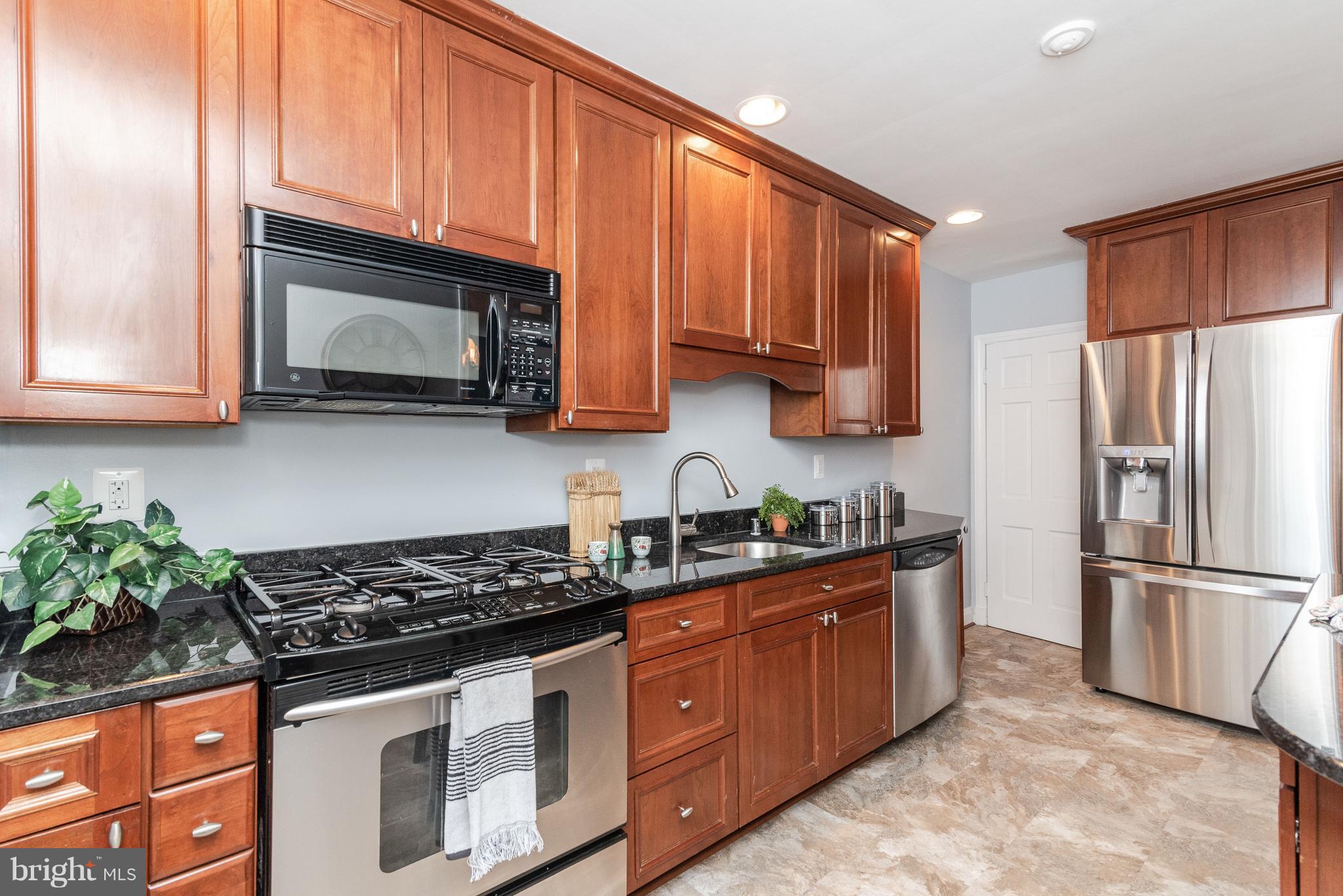 411 Lambeth Road Baltimore, MD 21228 - Photo 9 of 26 Granite counters & stainless steel appliances