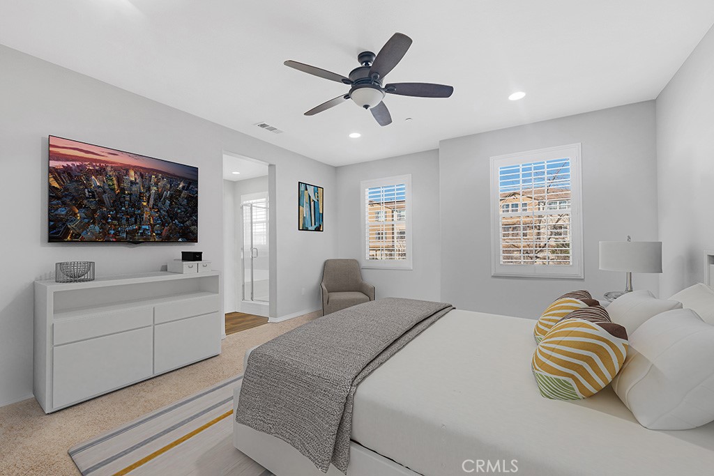 22104 Barrington Way Saugus, CA 91350 - Photo 11 of 31 a bedroom with a large bed and a window