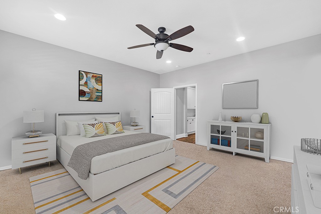 22104 Barrington Way Saugus, CA 91350 - Photo 12 of 31 a spacious bedroom with a bed and a ceiling fan
