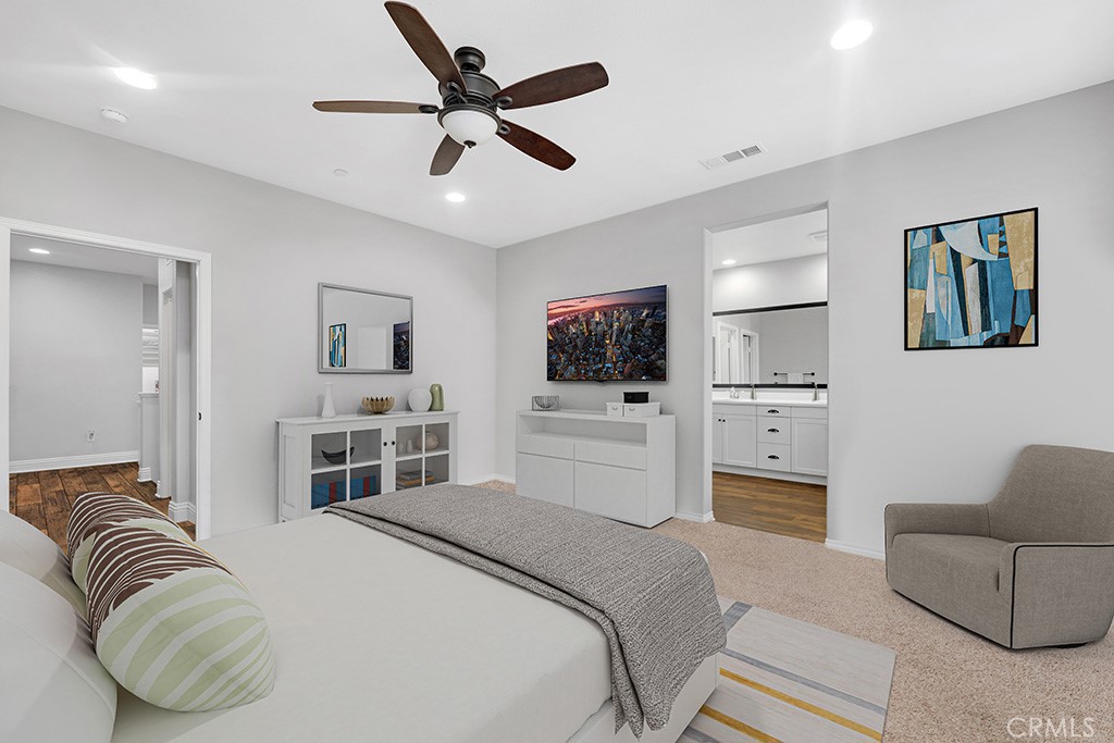 22104 Barrington Way Saugus, CA 91350 - Photo 13 of 31 a bedroom with a bed furniture and a flat screen tv