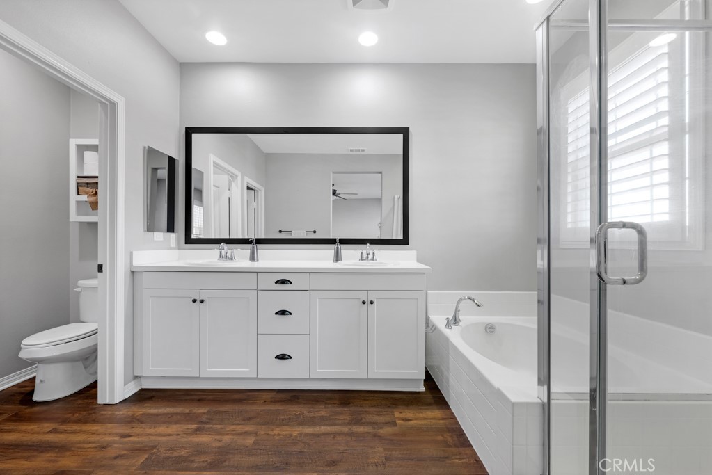 22104 Barrington Way Saugus, CA 91350 - Photo 15 of 31 a bathroom with a bathtub sink and mirror