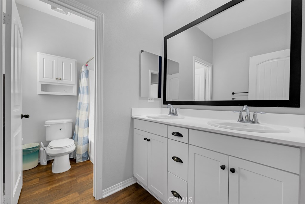 22104 Barrington Way Saugus, CA 91350 - Photo 19 of 31 a bathroom with a sink and a mirror