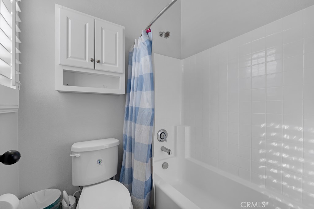 22104 Barrington Way Saugus, CA 91350 - Photo 20 of 31 a bathroom with a toilet and a shower