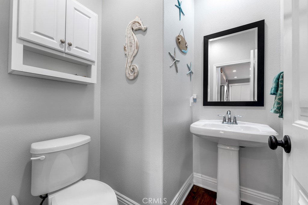 22104 Barrington Way Saugus, CA 91350 - Photo 9 of 31 a bathroom with a toilet sink and mirror