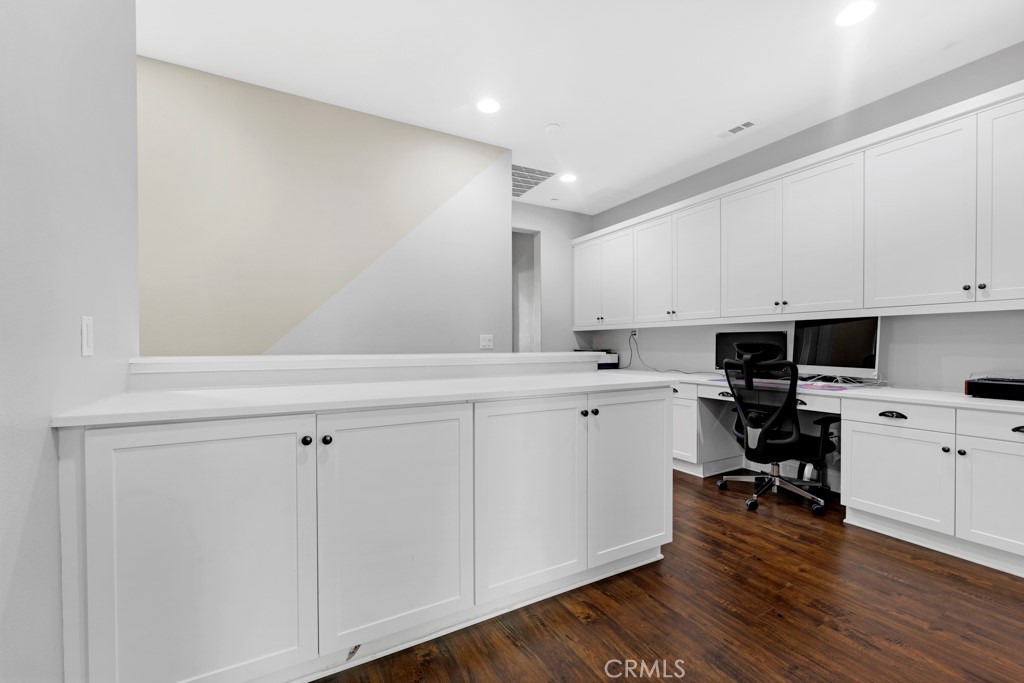 22104 Barrington Way Saugus, CA 91350 - Photo 10 of 31 a kitchen with white cabinets and appliances