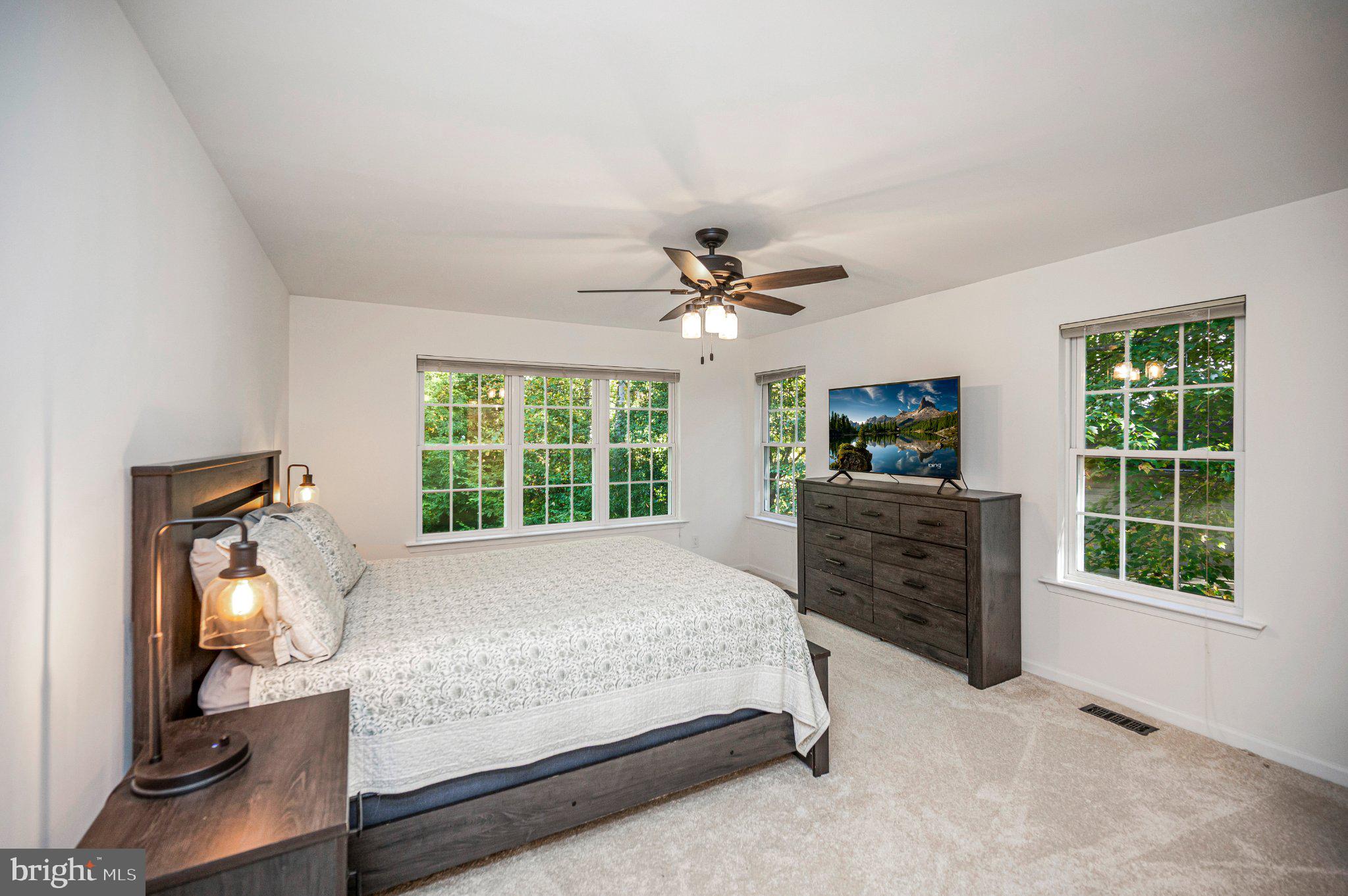 211 Battlefield Road Locust Grove, VA 22508 - Photo 27 of 57 A restful primary bedroom with room to unwind