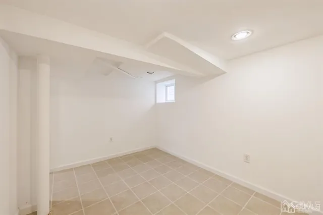 an empty room with a empty space and windows