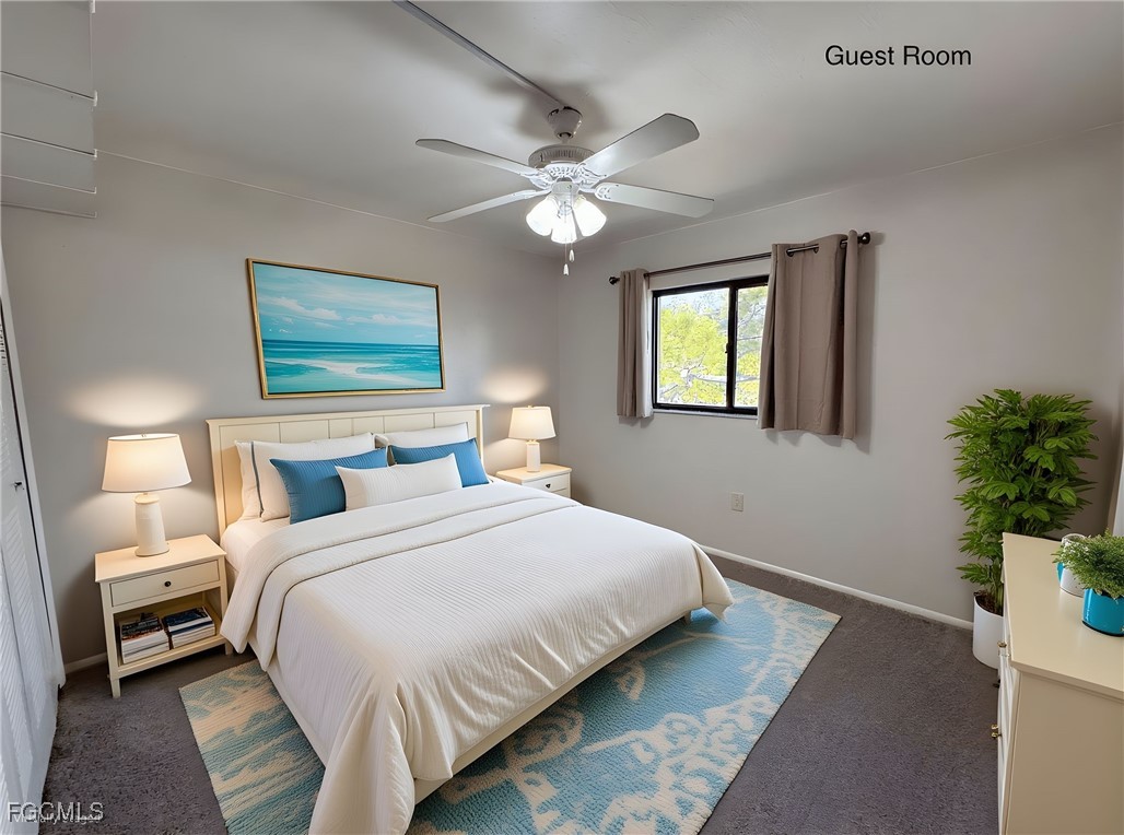 1211 Barrett Road, Unit 1106 North Fort Myers, FL 33903 - Photo 13 of 28 a bedroom with a bed and a chandelier
