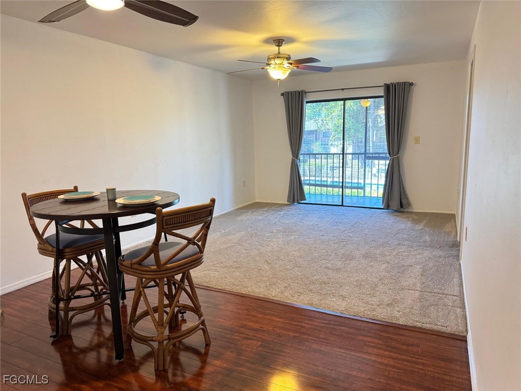 1211 Barrett Road, Unit 1106 North Fort Myers, FL 33903 - Photo 17 of 28 a view of a dining room with furniture and a chandelier