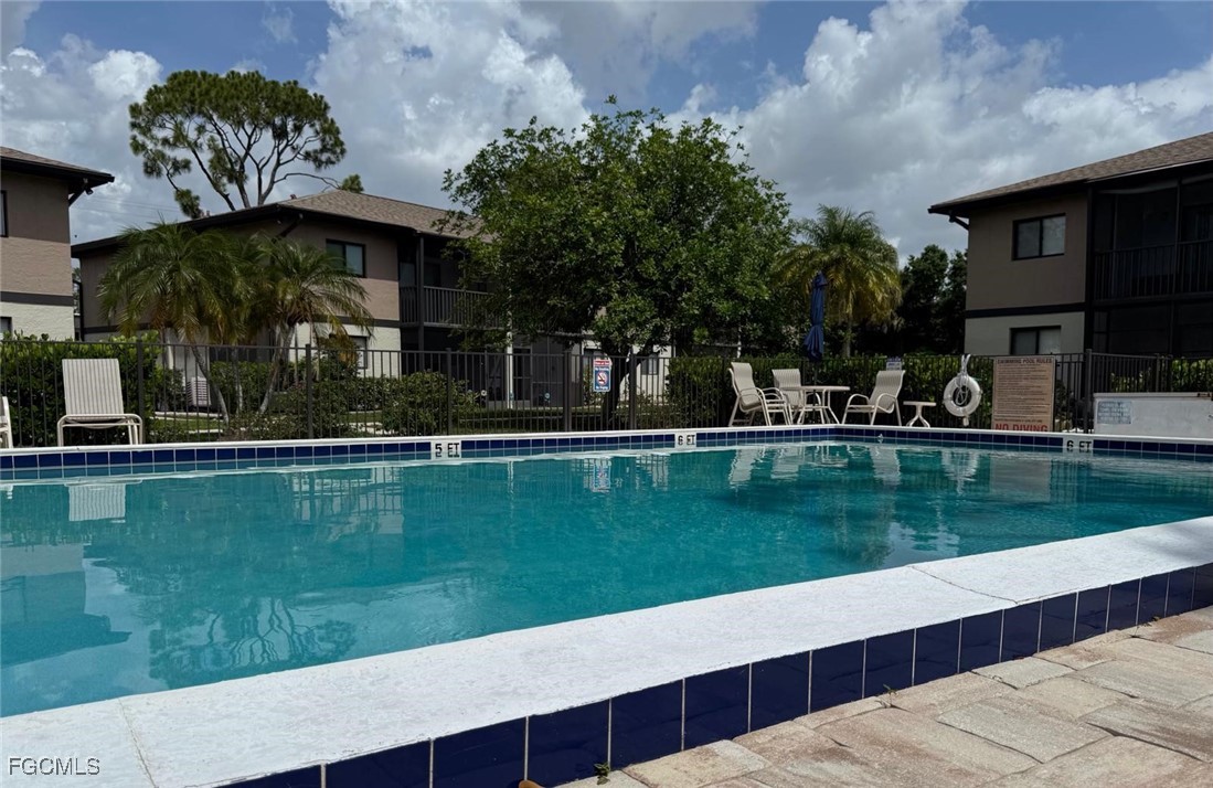 1211 Barrett Road, Unit 1106 North Fort Myers, FL 33903 - Photo 25 of 28 a view of a swimming pool with a garden