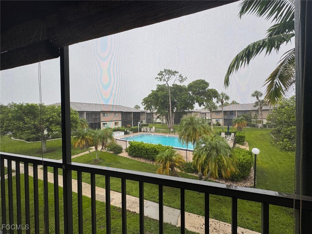 1211 Barrett Road, Unit 1106 North Fort Myers, FL 33903 - Photo 26 of 28 a view of a lake from a balcony